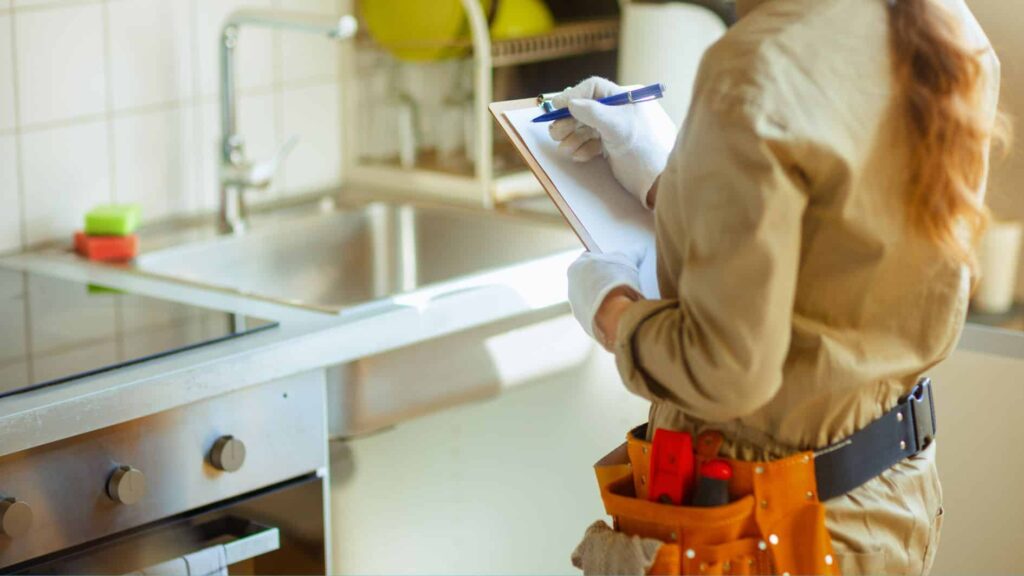 Woman checking plumbing